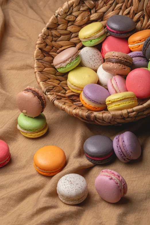 a basket full of assorted colorful donuts