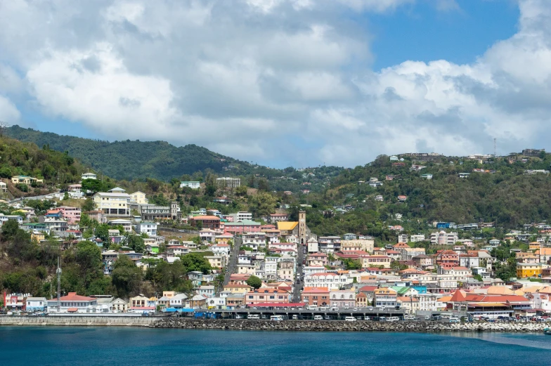 a city next to the ocean and mountains