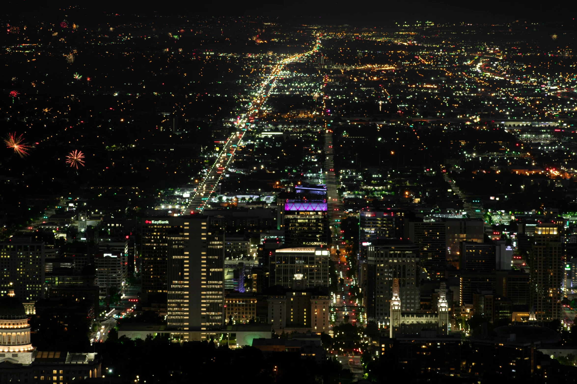 there is a very large city lit up at night