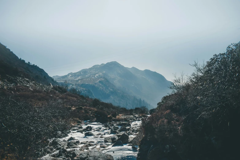 a river that has a mountain in the background