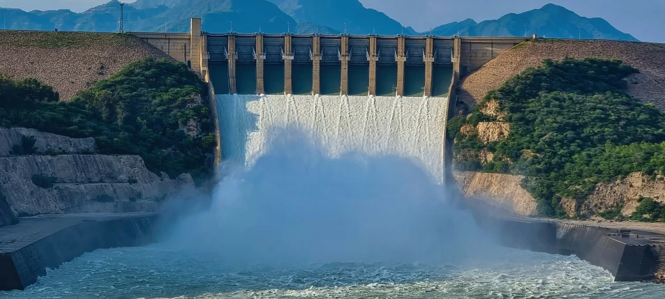 a water fall in a big body of water