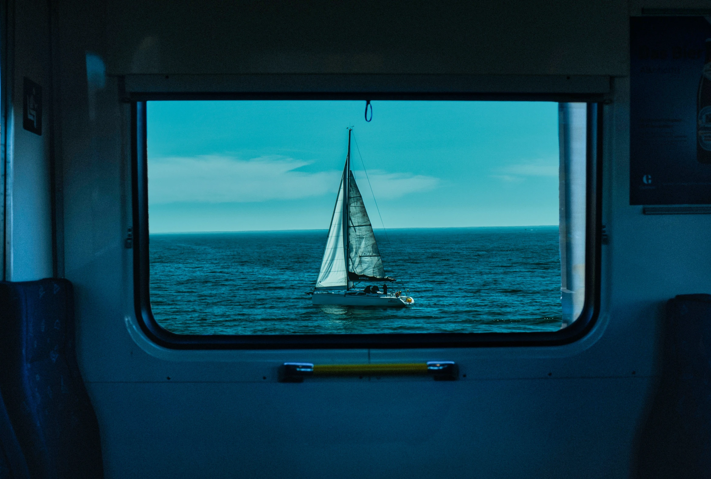 a window inside of a vehicle near the water