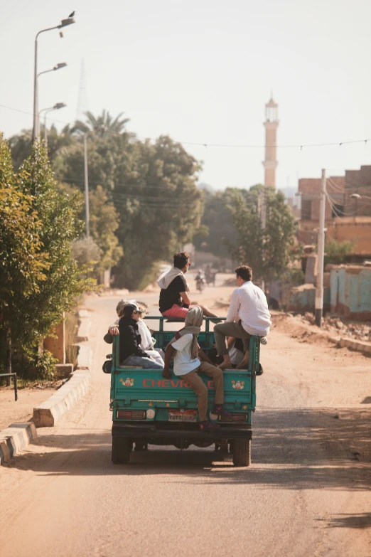 several people in the back of a vehicle