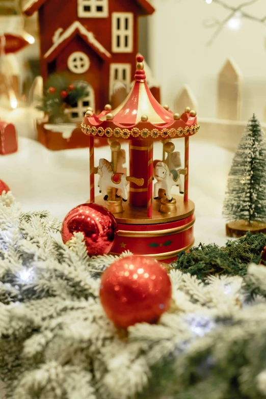 a christmas display featuring red, gold and silver decor