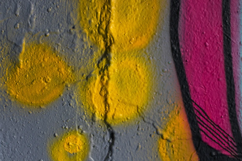 a wall with yellow circles painted on it