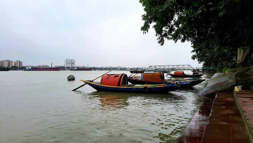 a couple of boats are floating on some water