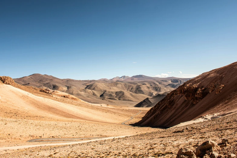 an empty mountain scene, with desert mountains behind it