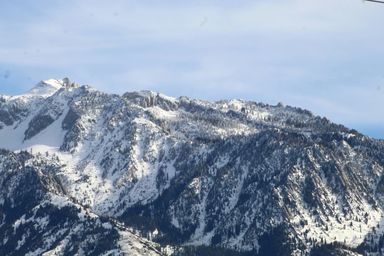 a ski slope with a large mountain and ski lift