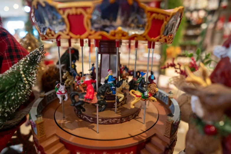 a carousel with several ornaments on the bottom