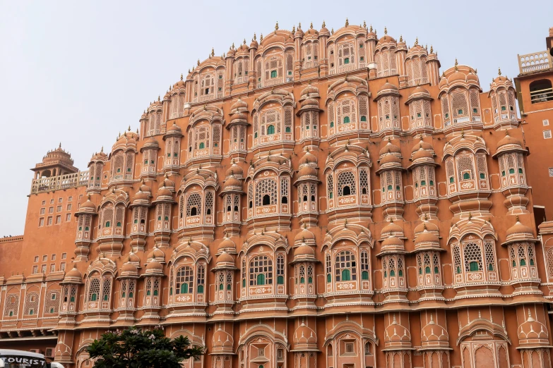 a brown building with a large tall tower