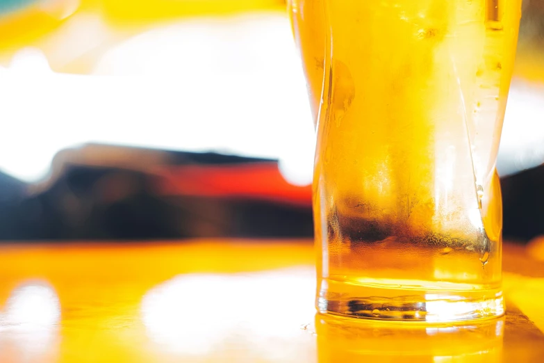 a close up image of a glass of beer
