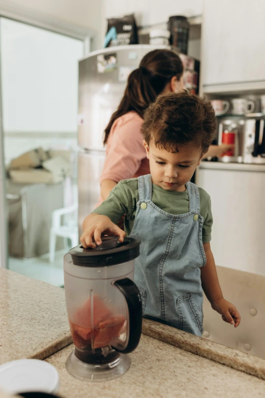 a  is playing in the kitchen