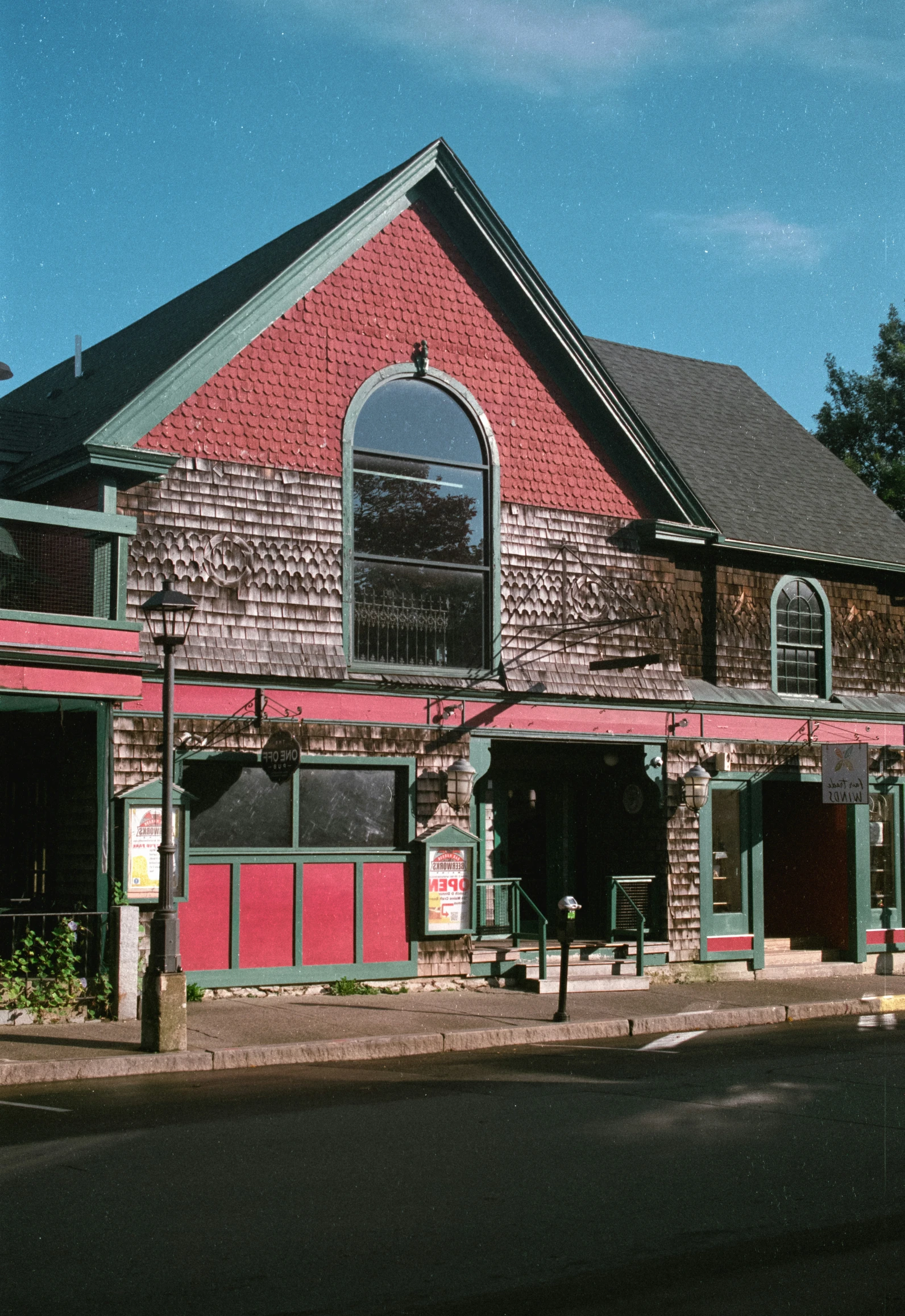 an old brick building sitting on the corner of a street