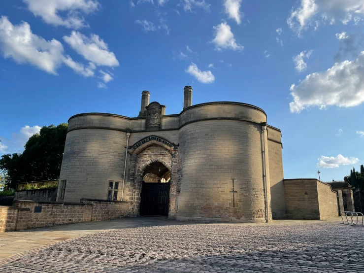 an old stone building with a very large entrance