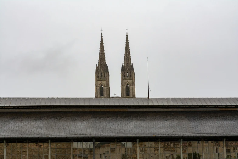 a large cathedral with two steeples and two windows on top