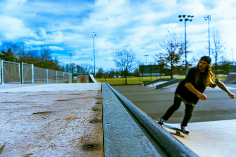 a guy on a skateboard in a skate park