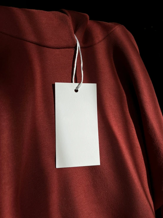 a po of a blank paper hanging on a jacket