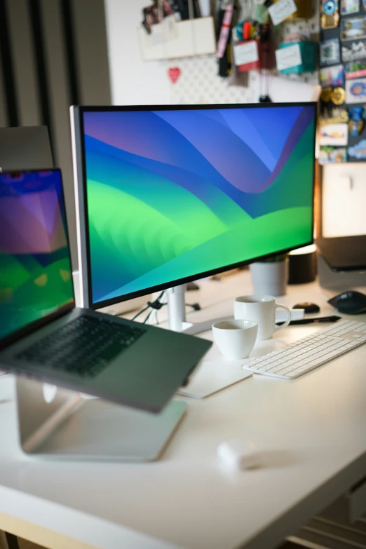 an empty office space with a desk that has two computers on it