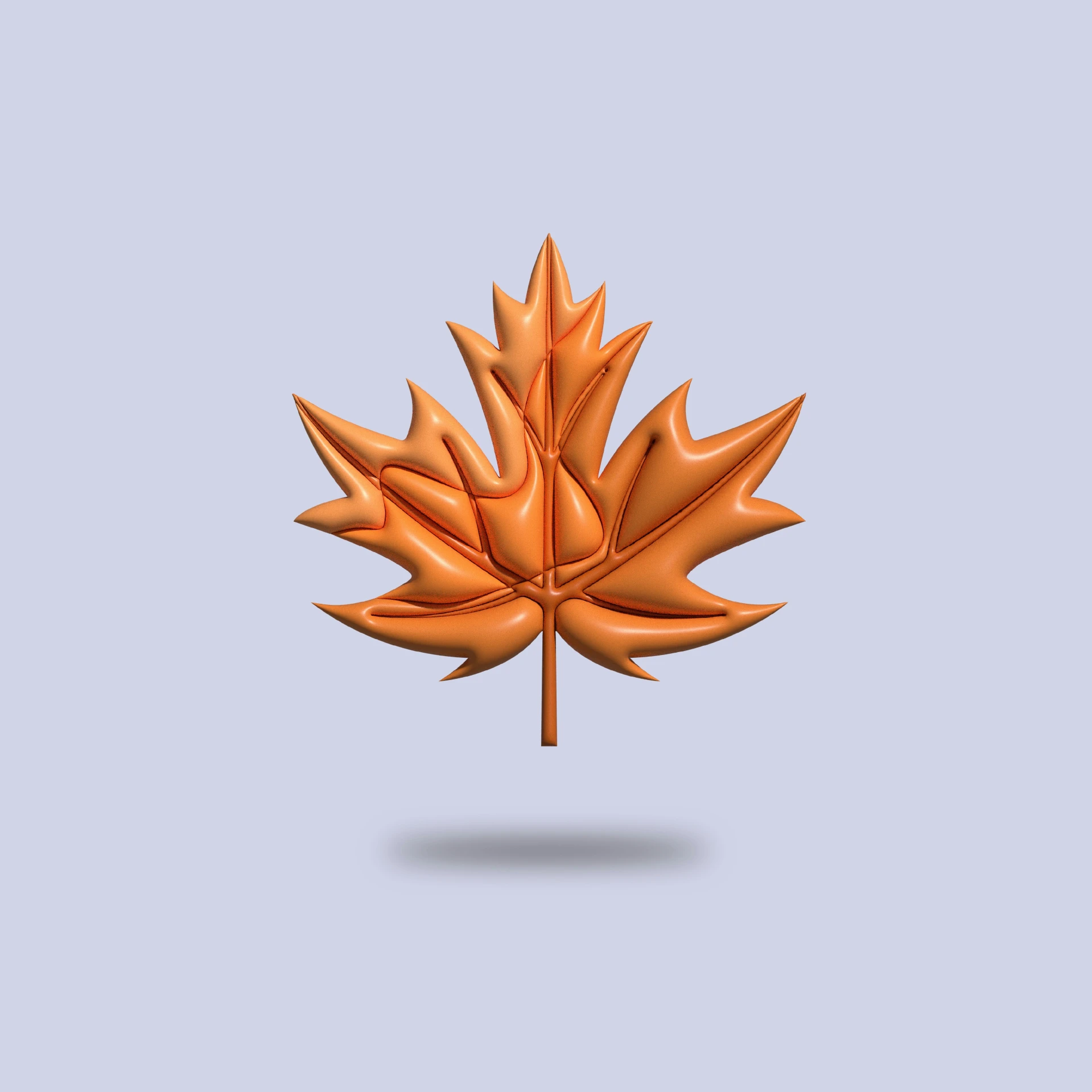 a golden maple leaf against a light blue background