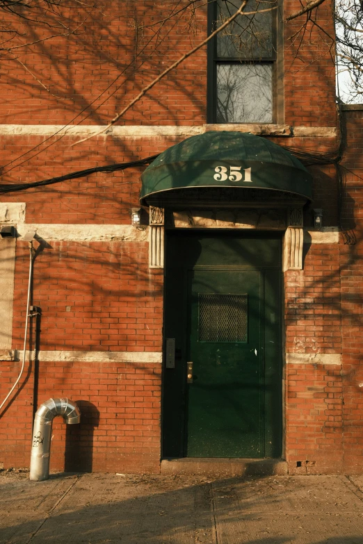 a door with a number on it is between two buildings