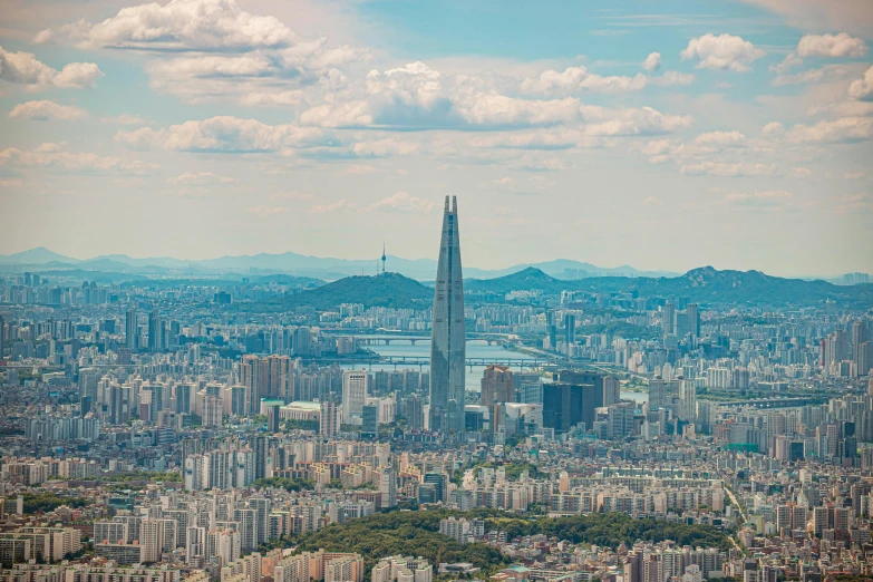 the skyline is shown with tall buildings in the foreground