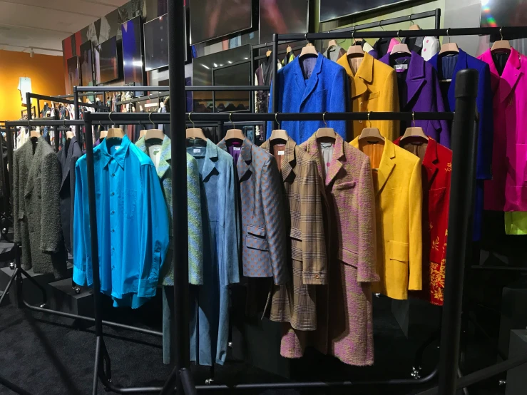 colorful shirts displayed in large display case indoors