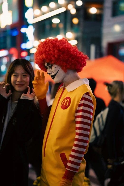 two people dressed as mcdonald and a creepy clown