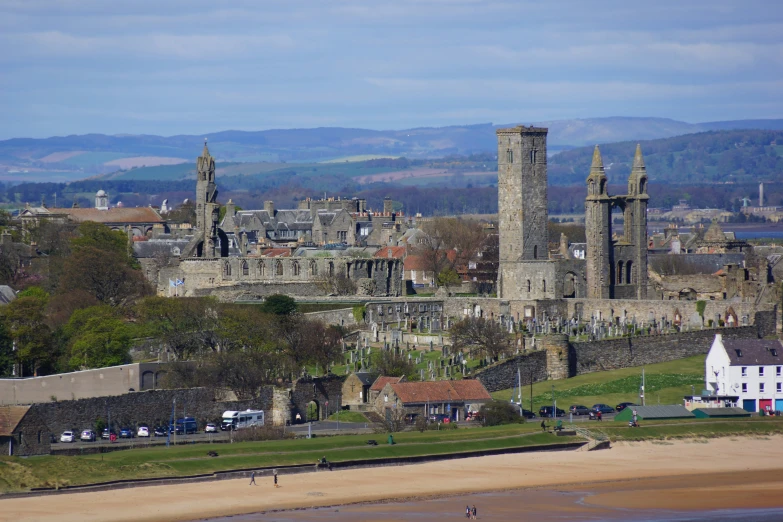 the city skyline is situated along side of a beach