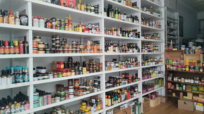 this is a po of a shelf filled with food and condiments