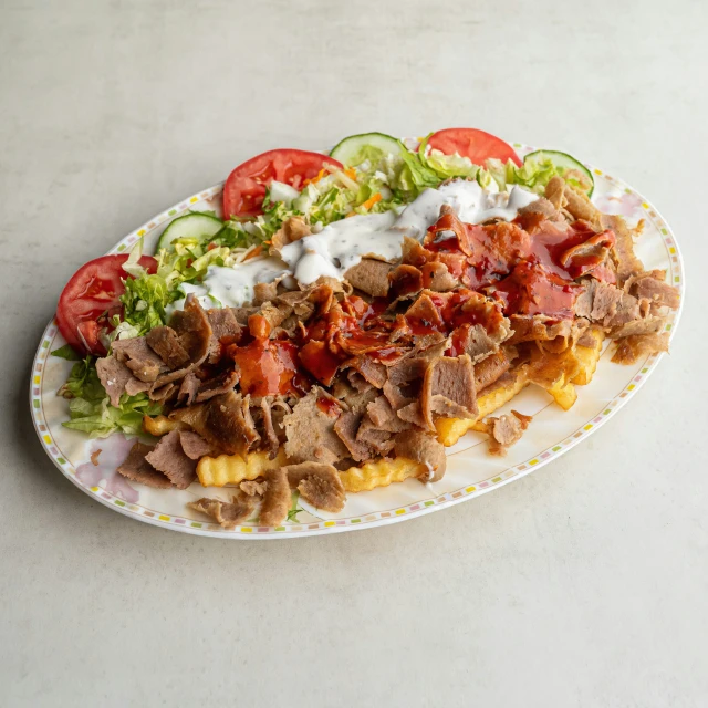 a dish is displayed on a plate with the salad