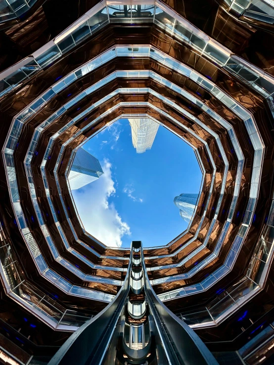 looking up from a circular, domed atrium in the city