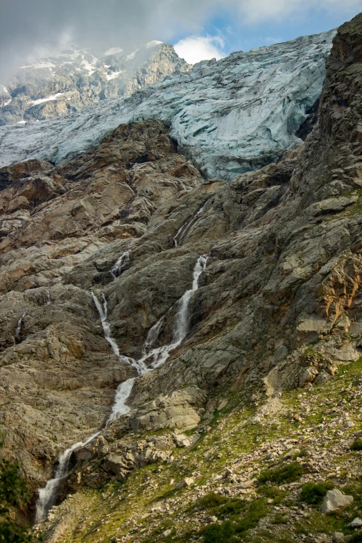 this is the view of a small waterfall in a rocky area