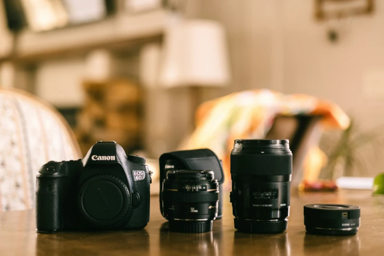 camera equipment sitting on a table next to a couch