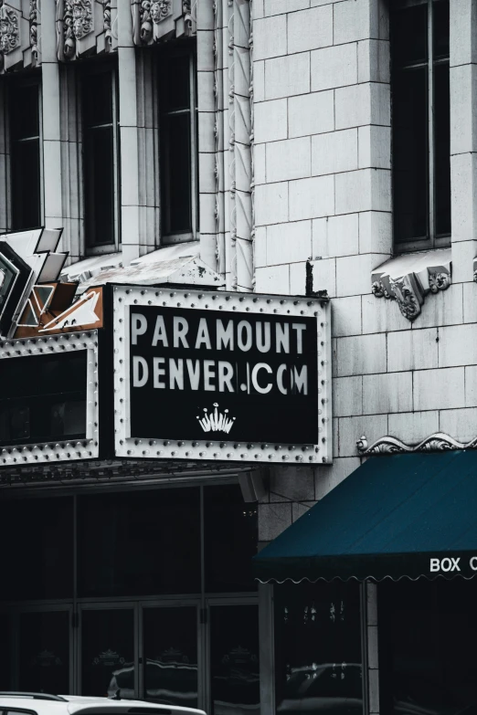 an old movie theater on a street corner