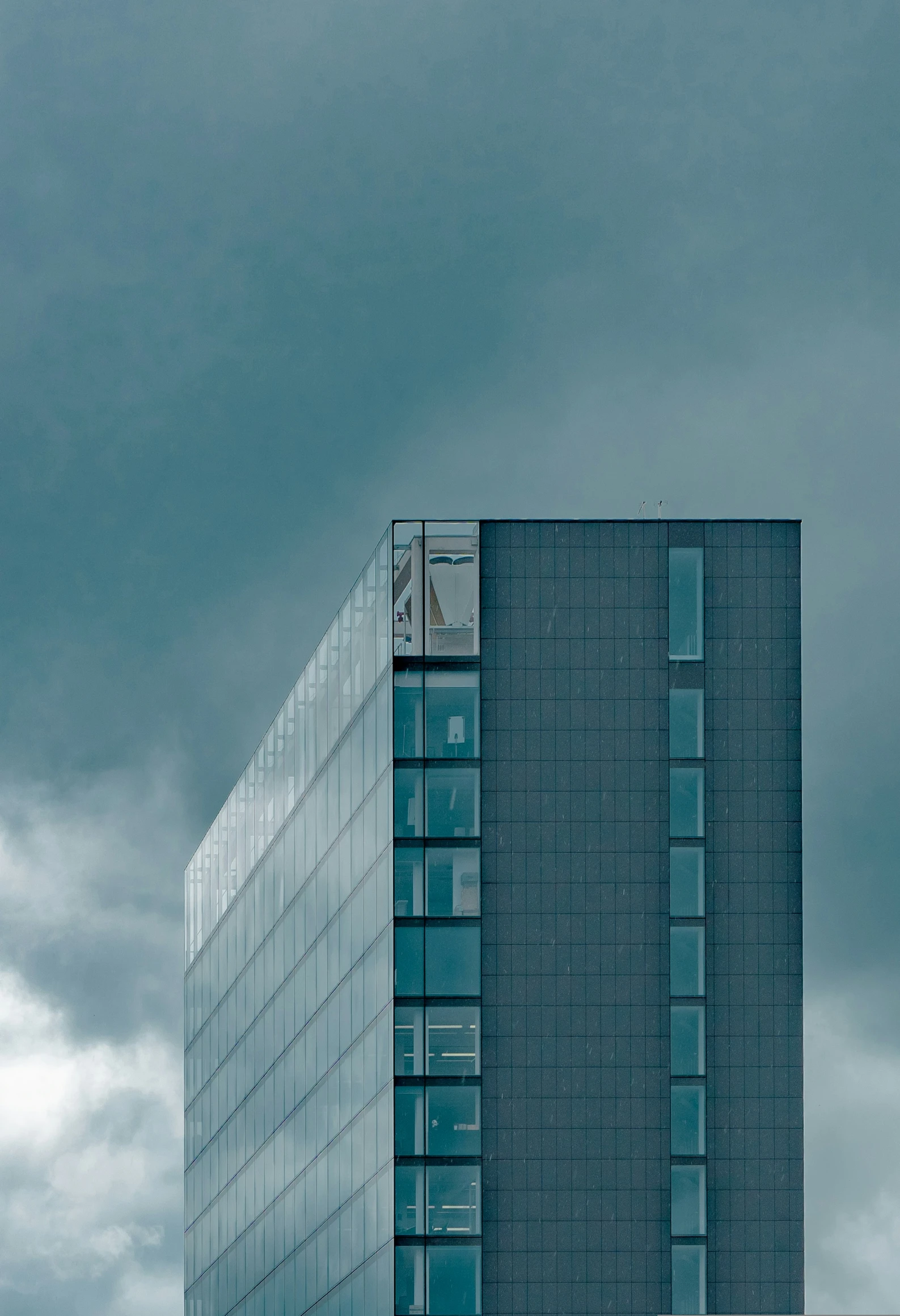 a building with a clock tower against a cloudy sky