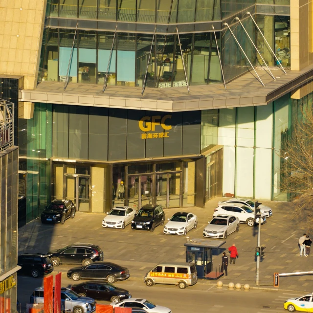 a parking lot with cars parked near the parking garage