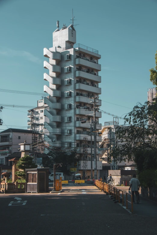 a white building with many balconies and windows