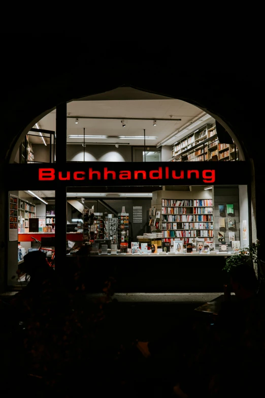 a bookshop is shown at night, in a black lit room