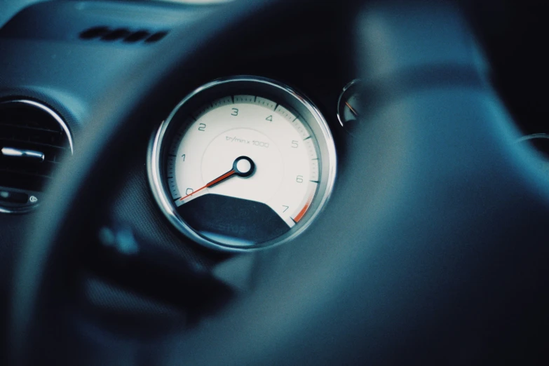 the gauge on a car dashboard, with dark colors