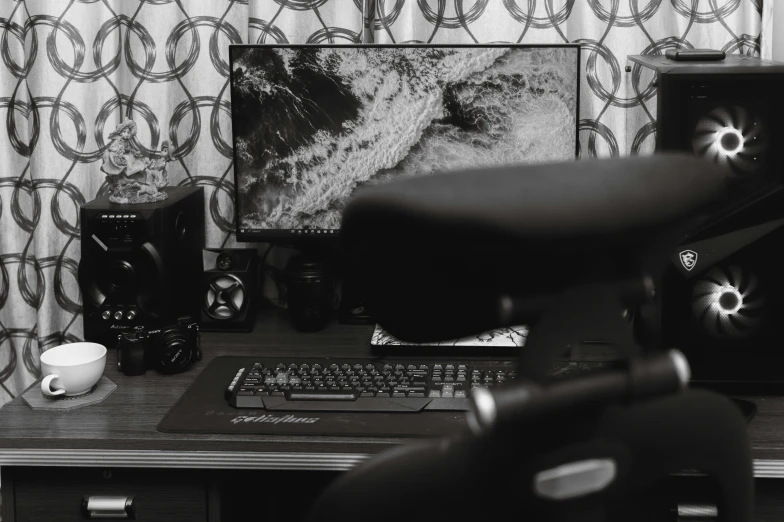 a black and white pograph with some electronic equipment on a desk