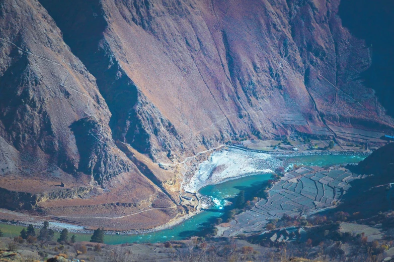 the view of some water that is flowing from a large canyon