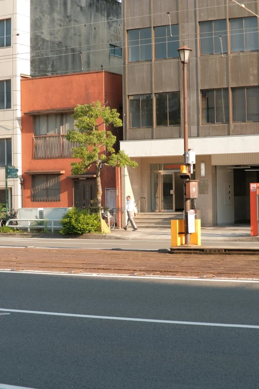 a parking lot next to a very tall building