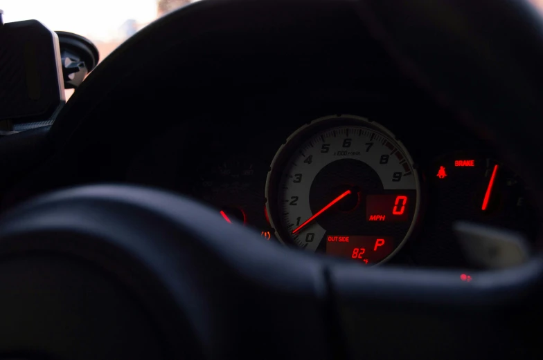 the dashboard with gauges on and other electronic equipment