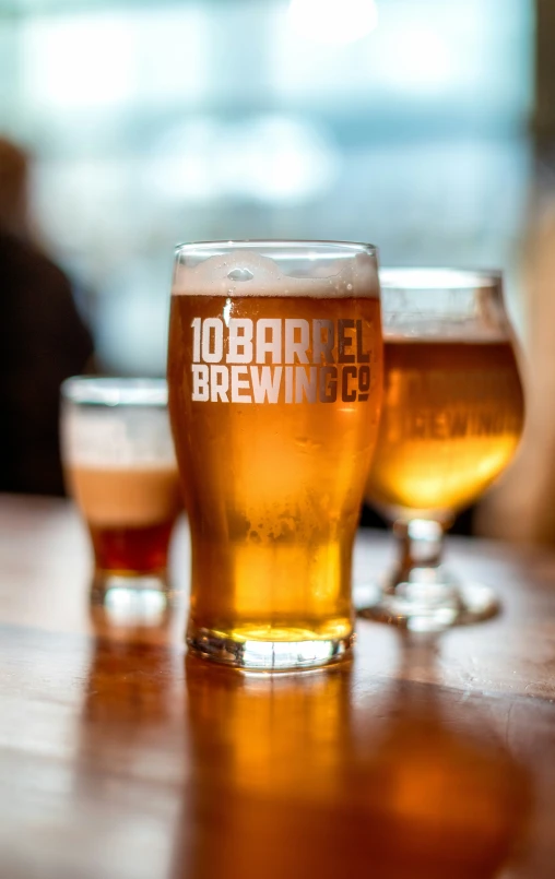 a variety of beer is shown in front of another one