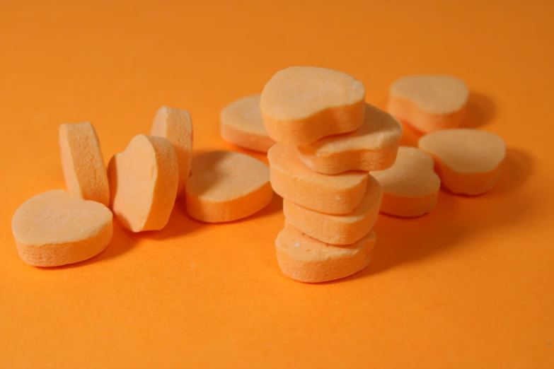 a pile of marshmallows sitting on a yellow surface