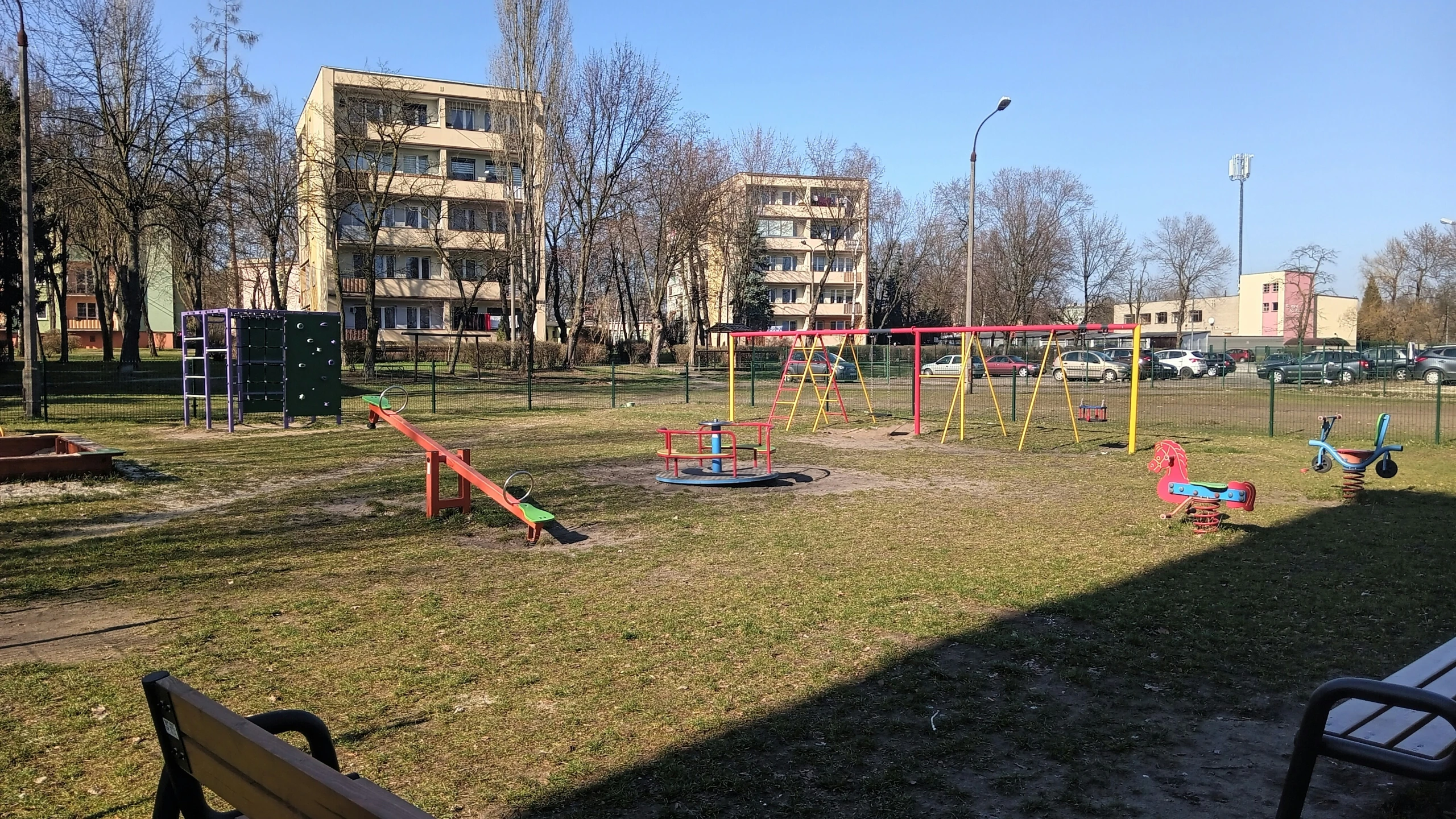 a playground is shown in a city park