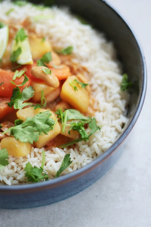 the food in the bowl is covered with vegetables