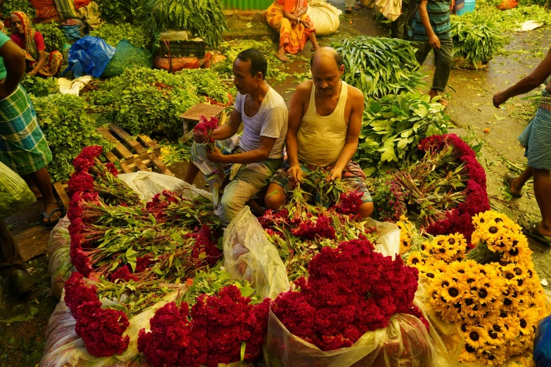 a large variety of flowers in a market