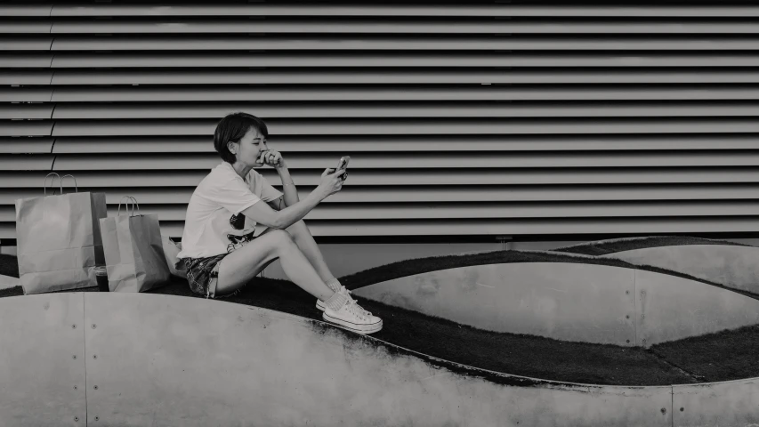 a person sitting on top of a concrete slab