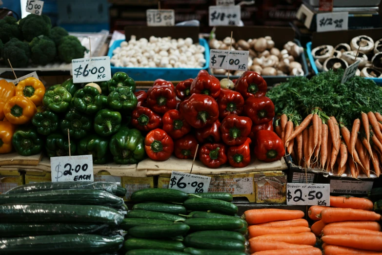 a lot of vegetables on display on shelves